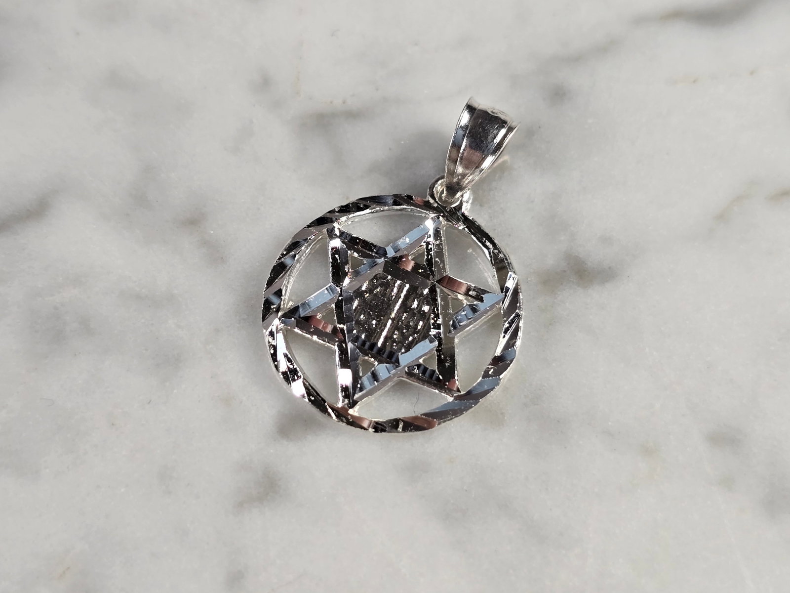 Sterling Silver Jewish Judaica Star of David Religious Pendant: A STERLING SILVER STAR OF DAVID PENDANT. THE PENDANT WEIGHS 1.6g AND MEASURES 7/8" LONG BY 5/8" WIDE. MAKES A GREAT GIFT FOR THAT SOMEONE SPECIAL. ANY QUESTIONS, PLEASE ASK. BE SURE TO CHECK OUT OUR O