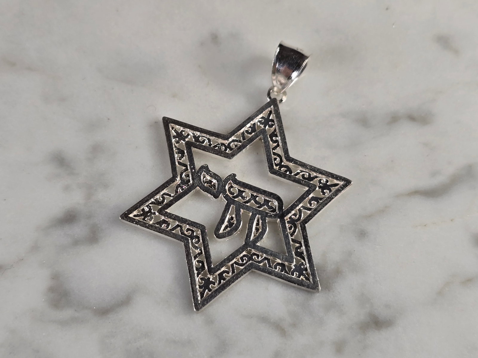 Sterling Silver Jewish Judaica Star of David Chai Pendant: A STERLING SILVER STAR OF DAVID CHAI PENDANT. THE PENDANT WEIGHS 3.6g, AND MEASURES 1 3/4" LONG BY 1 1/4" WIDE. MAKES A GREAT GIFT FOR THAT SOMEONE SPECIAL. ANY QUESTIONS, PLEASE ASK. BE SURE TO CHECK