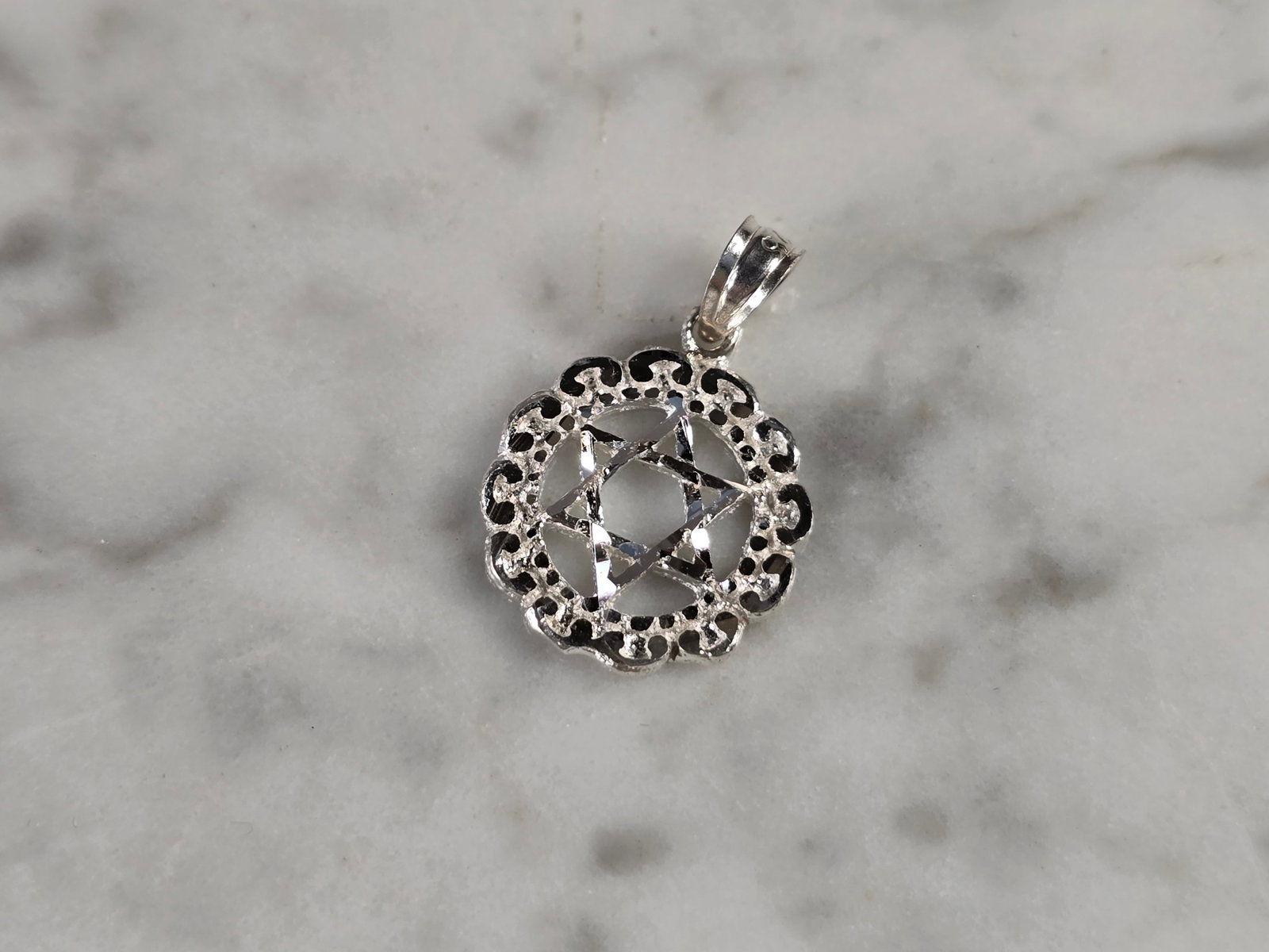 Sterling Silver Jewish Judaica Star of David Religious Pendant: A STERLING SILVER STAR OF DAVID PENDANT. THE PENDANT WEIGHS 1.2g AND MEASURES 3/4" LONG BY 1/2" WIDE. MAKES A GREAT GIFT FOR THAT SOMEONE SPECIAL. ANY QUESTIONS, PLEASE ASK. BE SURE TO CHECK OUT OUR O