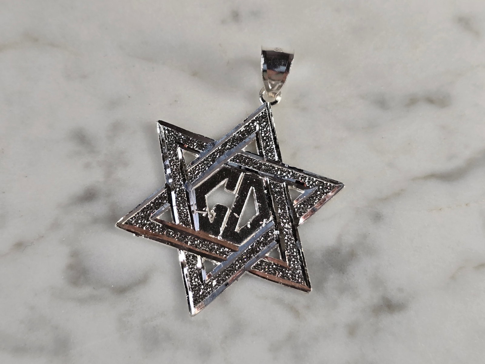 Sterling Silver Jewish Judaica Star of David Religious Pendant: A STERLING SILVER STAR OF DAVID PENDANT. THE PENDANT WEIGHS 3.4g AND MEASURES 1 5/8" LONG BY 1 1/8" WIDE. MAKES A GREAT GIFT FOR THAT SOMEONE SPECIAL. ANY QUESTIONS, PLEASE ASK. BE SURE TO CHECK OUT O