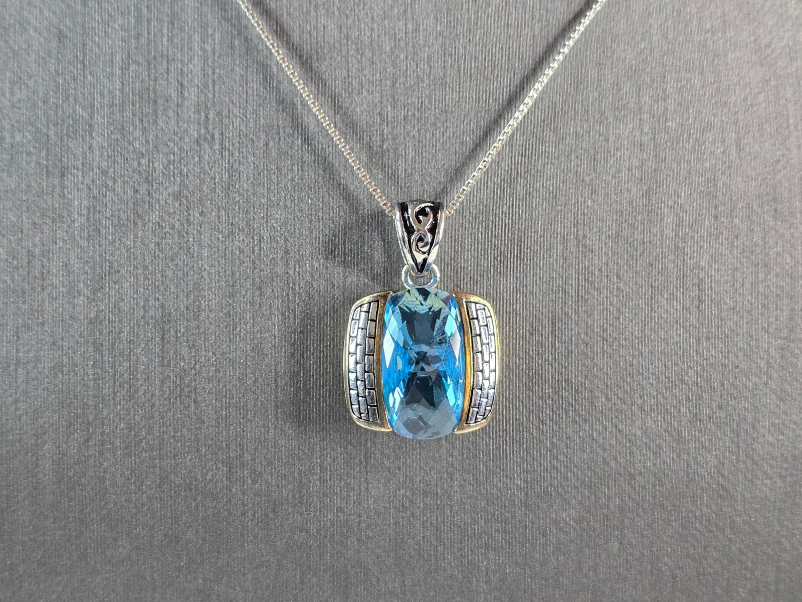 Womens Vintage Estate Sterling Silver Modernist Pendant Necklace: A WOMENS VINTAGE ESTATE STERLING SILVER AQUA COLORED MODERNIST PENDANT NECKLACE. NOT SURE IF THE STONE IS NATURAL OR MAN MADE. THE TOTAL WEIGHT IS 9.7g. NECKLACE IS 18 1/2" LONG, AND THE PENDANT IS 1"