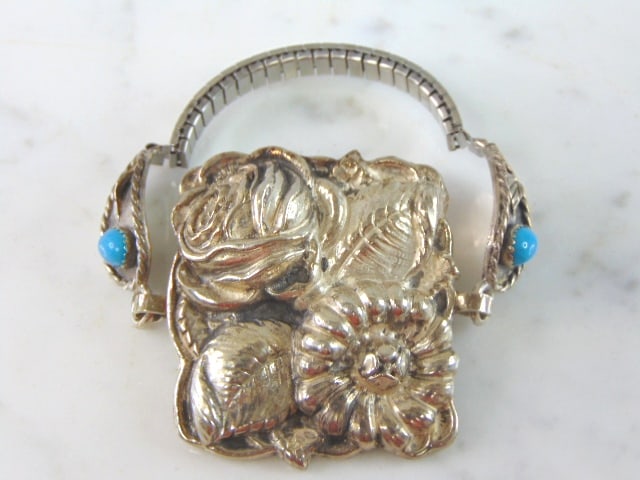 Womens Vintage Estate Sterling Silver Flower Bracelet: FOR SALE IS A LOVELY VINTAGE ESTATE STERLING SILVER FLOWER BRACELET. NOT SURE IF TURQUOISE STONES ARE NATURAL OR MAN MADE. BRACELET FACE MEASURE 2" LONG BY 1 3/4" WIDE AND WEIGHS 43.7g. THIS WOULD MAK