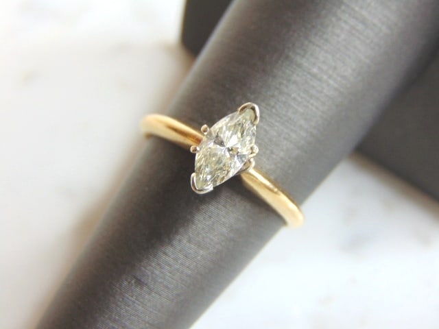 Womens 14K Gold Marquise Diamond Engagement Ring: A BEAUTIFUL VINTAGE 14K GOLD WOMEN'S ENGAGEMENT RING WITH A MARQUISE CUT DIAMOND THAT IS ABOUT .50ct IN SIZE. THE SIZE OF THE RING IS A 6.5, AND WEIGHS 2.6g. MAKES A NICE GIFT FOR THAT SOMEONE SPECIAL
