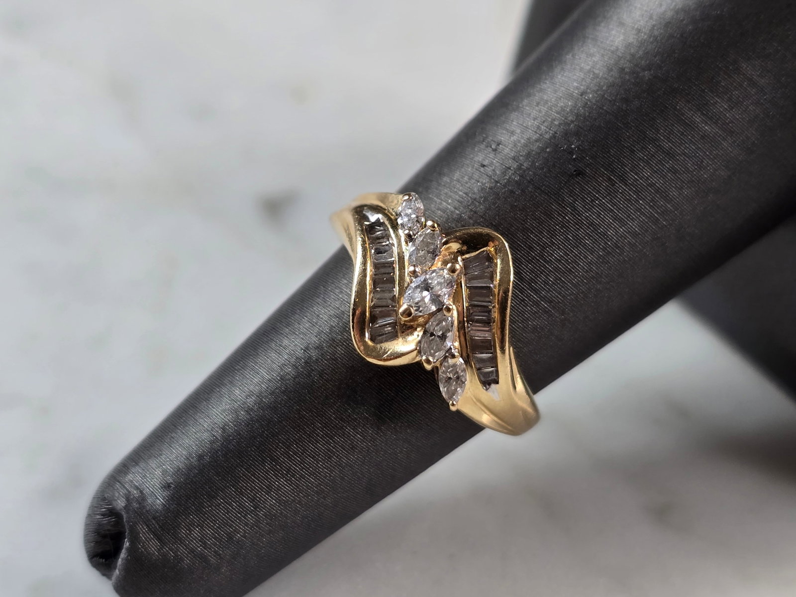 Womens Vintage Estate 14K Yellow Gold Modernist Diamond Ring: A WOMENS VINTAGE ESTATE 14K YELLOW GOLD MODERNIST DIAMOND RING. RING HAS ABOUT .41cts OF DIAMONDS. THE TOTAL WEIGHT IS 3.5g, AND IS A SIZE 5.75. THE WIDTH OF THE RING IS 1/2". ANY QUESTIONS PLEASE DON