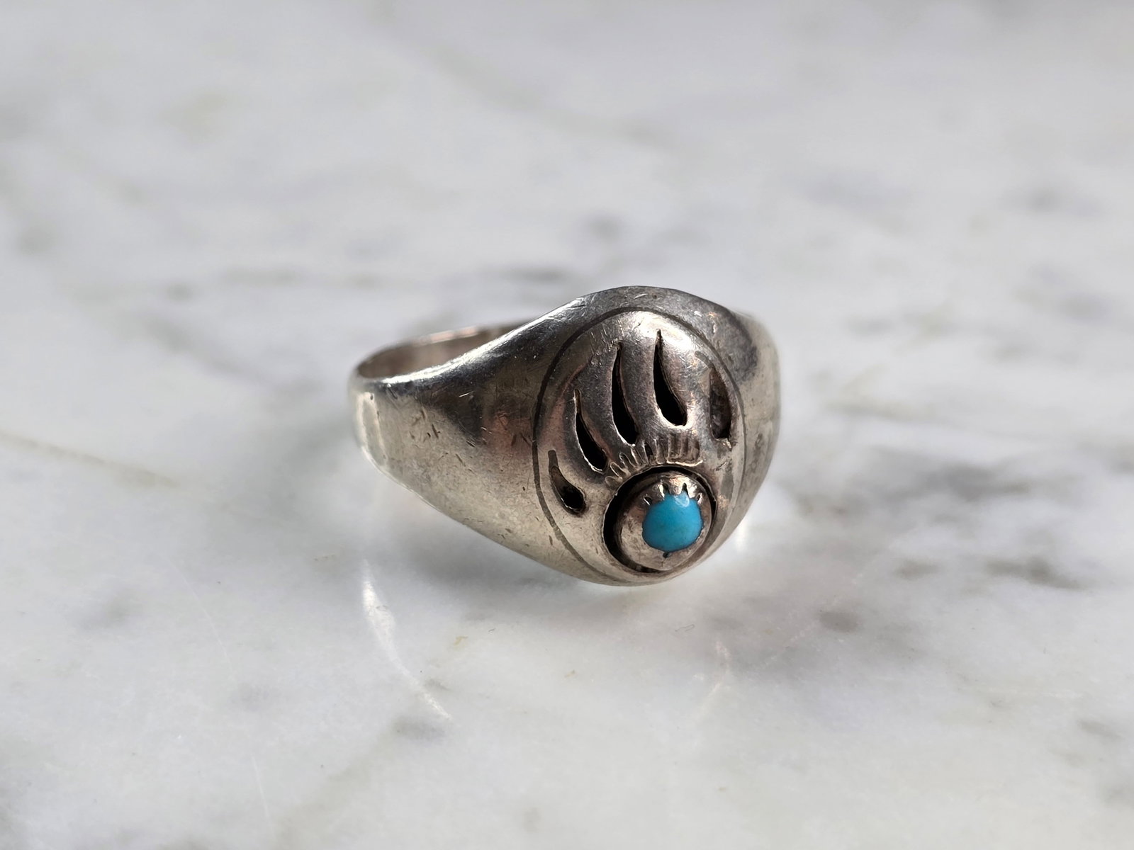 Mens Vintage Sterling Silver Ray Fierro Navajo Bear Paw Ring: A MENS VINTAGE ESTATE STERLING SILVER NAVAJO BEAR PAW RING MADE BY RAY FIERRO. THE TOTAL WEIGHT IS 7.9g, AND IS A SIZE 12.0. THE WIDTH OF THE RING IS 5/8". THIS RING WOULD MAKE A GREAT GIFT FOR SOMEON