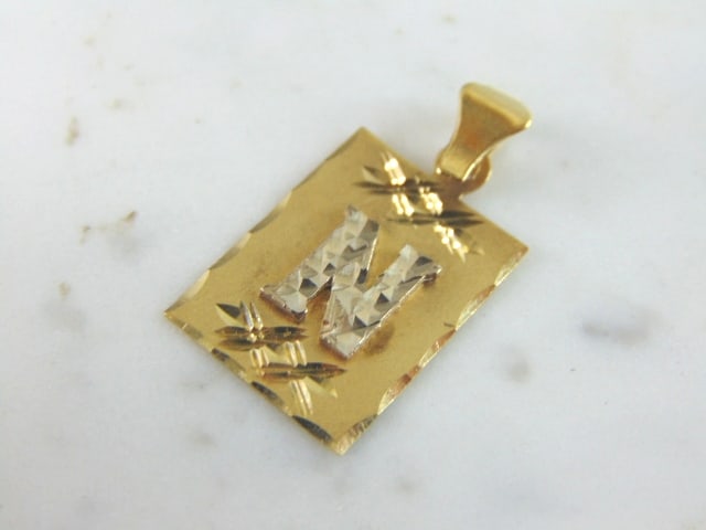 Womens Vintage Estate 14k Gold "N" Pendant: A WOMENS VINTAGE ESTATE 14K YELLOW & WHITE GOLD "N" PENDANT. THE PENDANT MEASURES 1 1/8" LONG BY 1/2" WIDE. THIS IS A LOVELY GIFT FOR THAT SOMEONE SPECIAL. ANY QUESTIONS PLEASE DONT HESITATE TO ASK. B