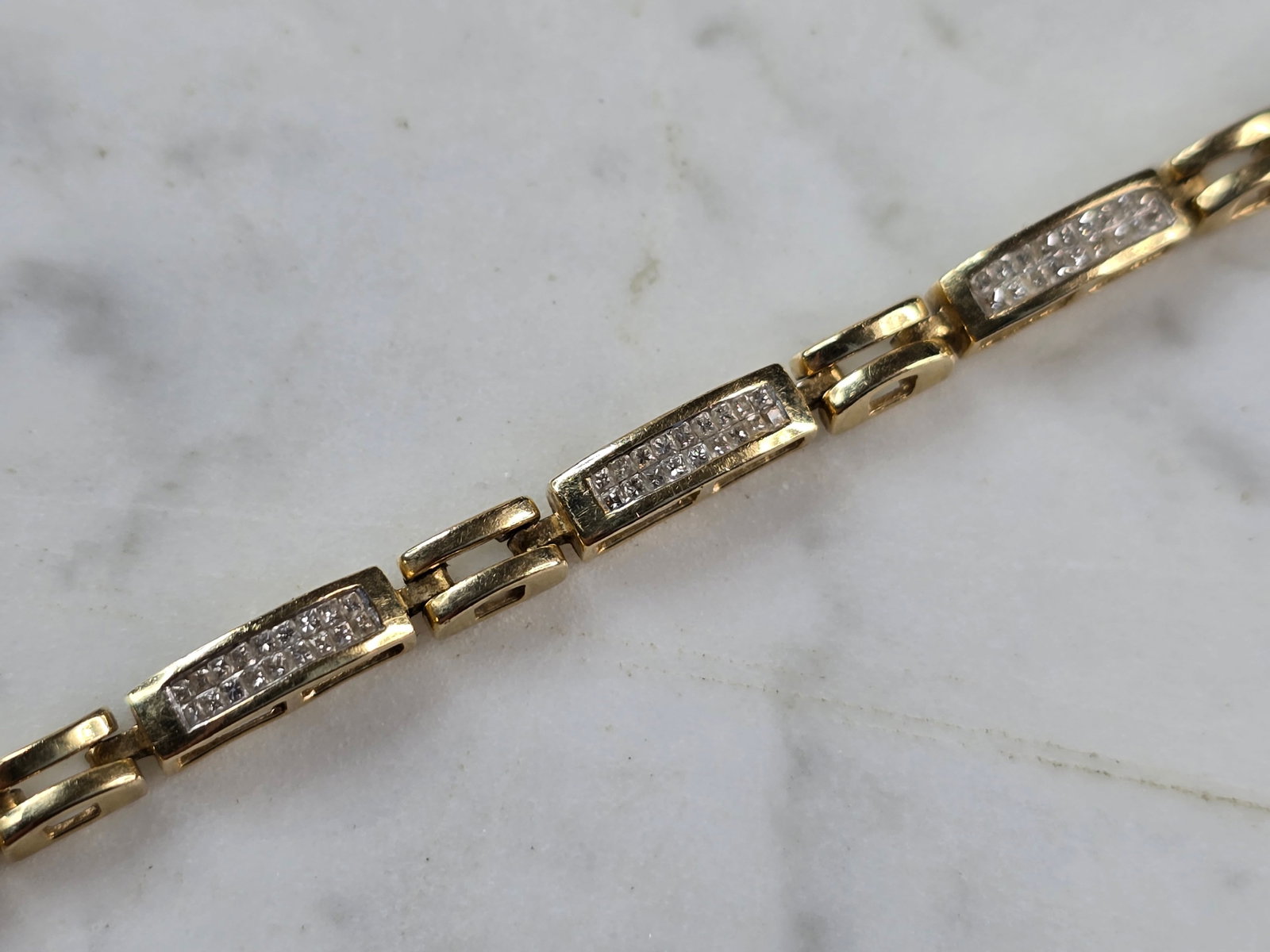 Womens Vintage Estate 14K Yellow Gold Diamond Tennis Bracelet: A WOMENS VINTAGE ESTATE 14K YELLOW GOLD DIAMOND TENNIS BRACELET. THE BRACELET MEASURES 8" LONG BY 3/16" WIDE, AND WEIGHS 12.0g. THERE ARE 180 TINY DIAMONDS IN THIS BRACELET. WOULD MAKE A GREAT GIFT FO