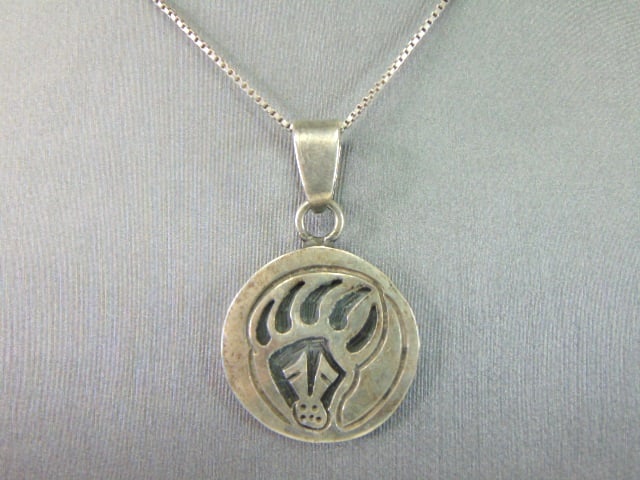 Womens Sterling Silver Southwestern Bear Claw Necklace: A VERY NICE STERLING SILVER SOUTHWESTERN BEAR CLAW NECKLACE THAT WEIGHS 12.5g. THE NECKLACE MEASURES 31" LONG AND THE PENDANT MEASURES 1 5/8" LONG BY 1" WIDE. ANY OTHER QUESTIONS PLEASE DONT HESITATE 