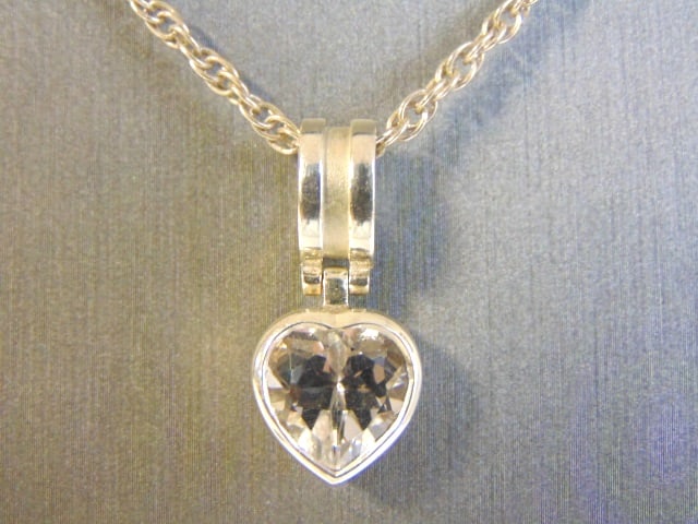 Womens Sterling Silver Heart CZ Pendant & Necklace: FOR SALE IS THIS WOMENS VINTAGE ESTATE .925 STERLING SILVER HEART CZ STONE PENDANT WITH NECKLACE. THE PENDANT WEIGHS 11.3g AND MEASURES 1" LONG BY 1/2" WIDE. NECKLACE MEASURES 24 1/2". MAKES A GREAT G
