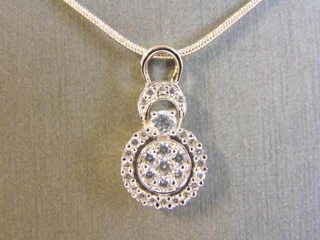 Womens Sterling Silver CZ Stones Pendant W/ Necklace: FOR SALE IS THIS WOMENS VINTAGE ESTATE .925 STERLING SILVER CZ STONES PENDANT WITH NECKLACE. NOT SURE IF STONES ARE REAL OR MAN MADE. TOGETHER NECKLACE AND PENDANT WEIGHS 5.6g AND PENDANT MEASURES 7/8