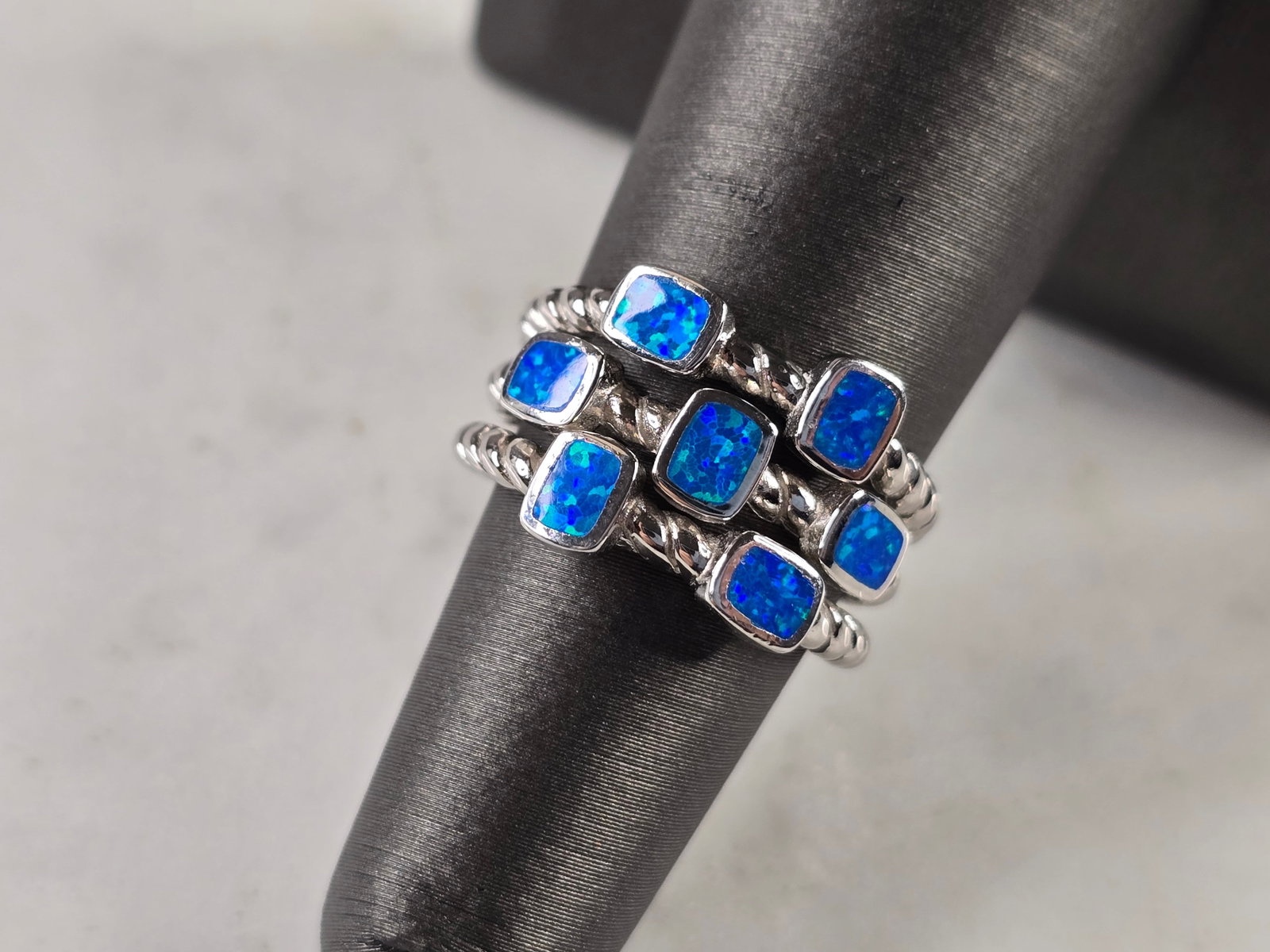 Womens Estate Sterling Silver Modernist Blue Opal Ring: A WOMENS ESTATE STERLING SILVER MODERNIST BLUE OPAL RING. THE RING IS A SIZE 6.0, AND WEIGHS 6.3g. THE WIDTH OF THE RING IS 1/2". NOT SURE IF THE OPAL IS NATURAL OR MAN MADE. THE RING MAKES A BEAUTIFU