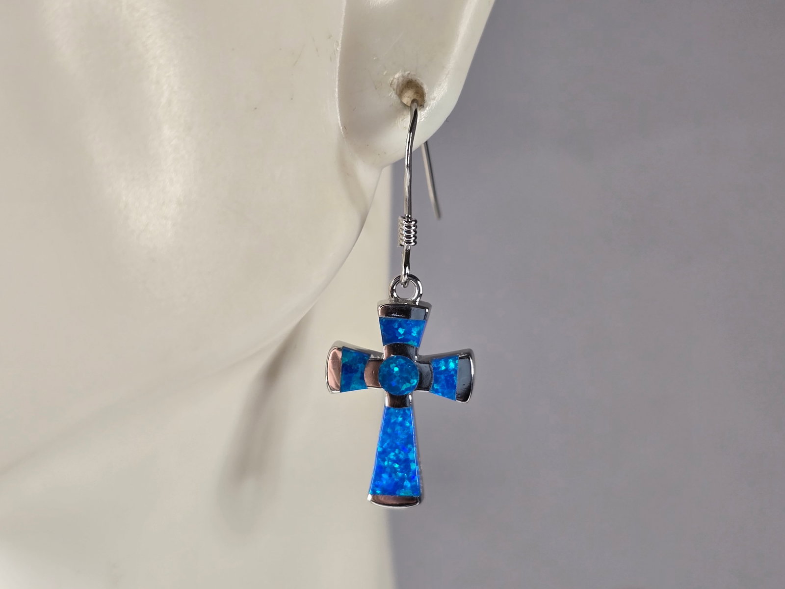 Womens Estate Sterling Silver Blue Opal Cross Earrings: A PAIR OF WOMENS STERLING SILVER BLUE OPAL COLORED CROSS EARRINGS THAT WEIGH 3.0g AND MEASURES 1 1/4" LONG BY 1/2" WIDE. NOT SURE IF STONES ARE REAL OR MAN MADE. ANY QUESTIONS, PLEASE DO NOT HESITATE 