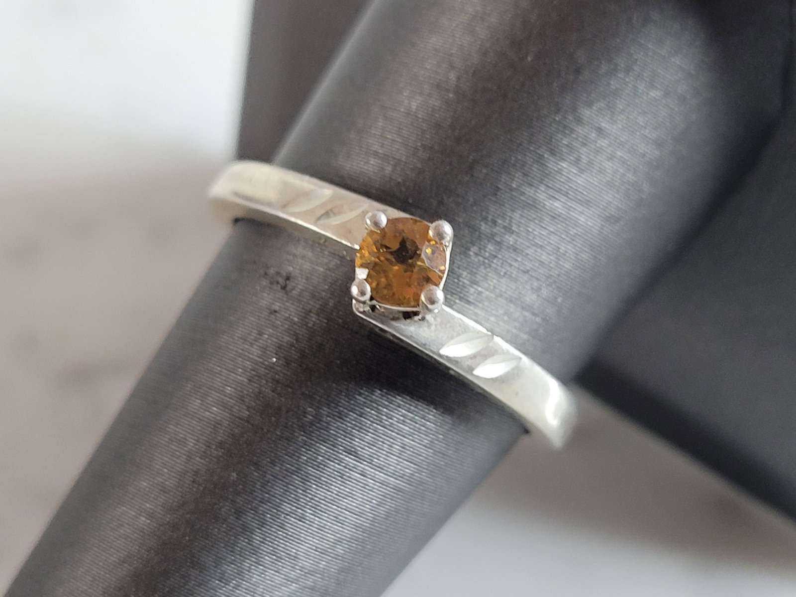 Womens Vintage Estate Sterling Silver Citrine Colored Ring: A WOMENS VINTAGE ESTATE STERLING SILVER RING WITH A CITRINE COLORED STONE. THE RING WEIGHS 2.7g, AND IS A SIZE 8.75. THE WIDTH OF THE RING IS 1/4". NOT SURE IF THE STONE IS REAL OR NOT. ANY QUESTIONS 