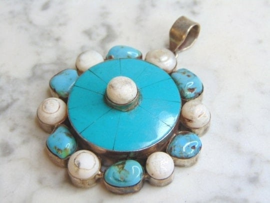 Womens Vintage Sterling Silver Turquoise Stone Pendant: FOR SALE IS THIS WOMENS VINTAGE ESTATE STERLING SILVER TURQUOISE STONE PENDANT . NOT SURE IF STONE IS REAL OR MAN MADE. PENDANT WEIGHS 48.5g AND PENDANT MEASURES 3 1/8" LONG BY 2 5/8" WIDE. MAKES A GR