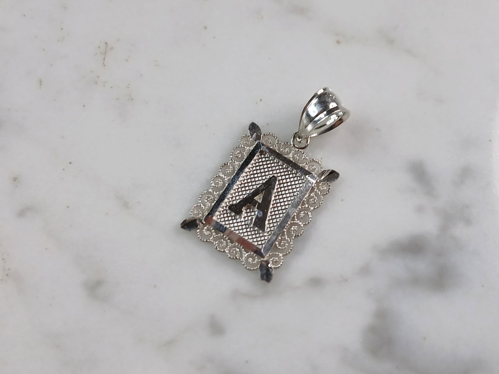Womens Sterling Silver Initial Letter " A " Pendant: A WOMENS STERLING SILVER INITIAL LETTER "A" PENDANT. PENDANT WEIGHS 1.0g AND MEASURES 7/8" LONG BY 1/2" WIDE. MAKES A GREAT GIFT FOR THAT SOMEONE SPECIAL. ANY QUESTIONS, PLEASE ASK. BE SURE TO CHECK O