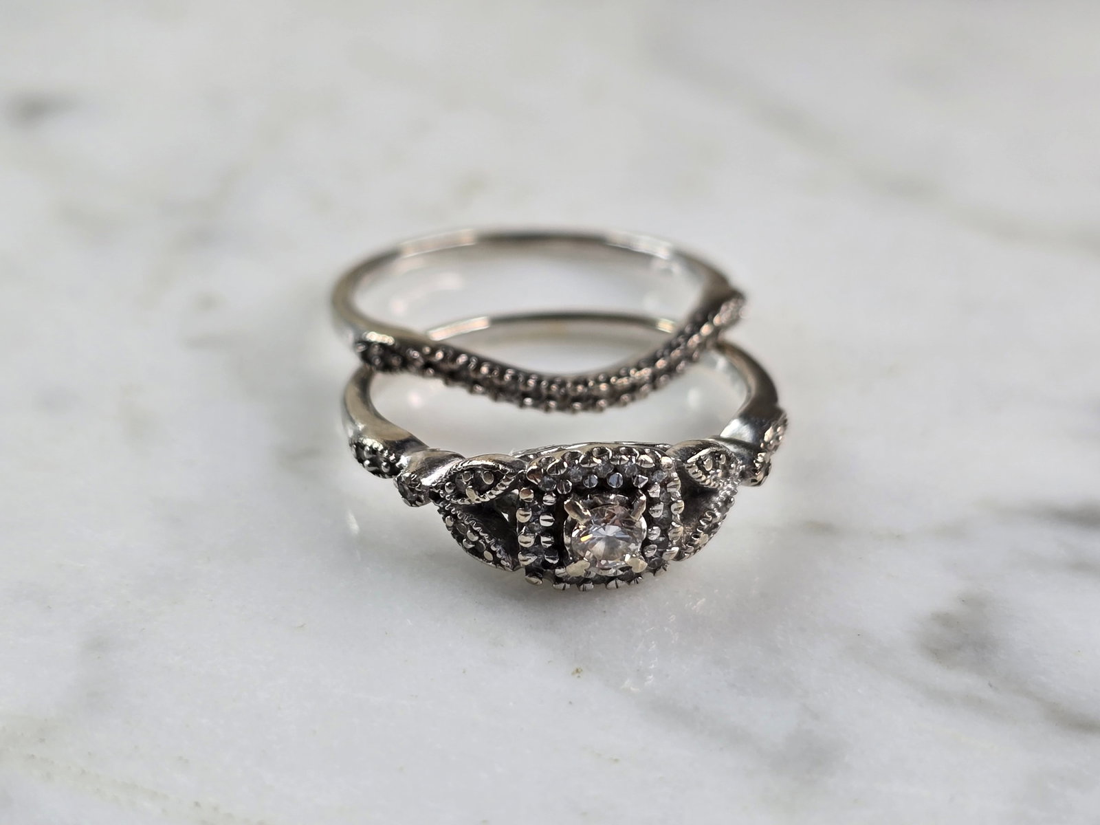 Womens Vintage Estate 10K White Gold Diamond Ring Set: A WOMENS VINTAGE ESTATE 10K WHITE GOLD DIAMOND RING SET. THE RING IS A SIZE 7.25, AND WEIGHS 3.7g. RING HAS ABOUT 0.55cts OF DIAMONDS. THE WIDTH OF THE TWO TOGETHER IS 3/8". RINGS ARE MARKED ON THE IN