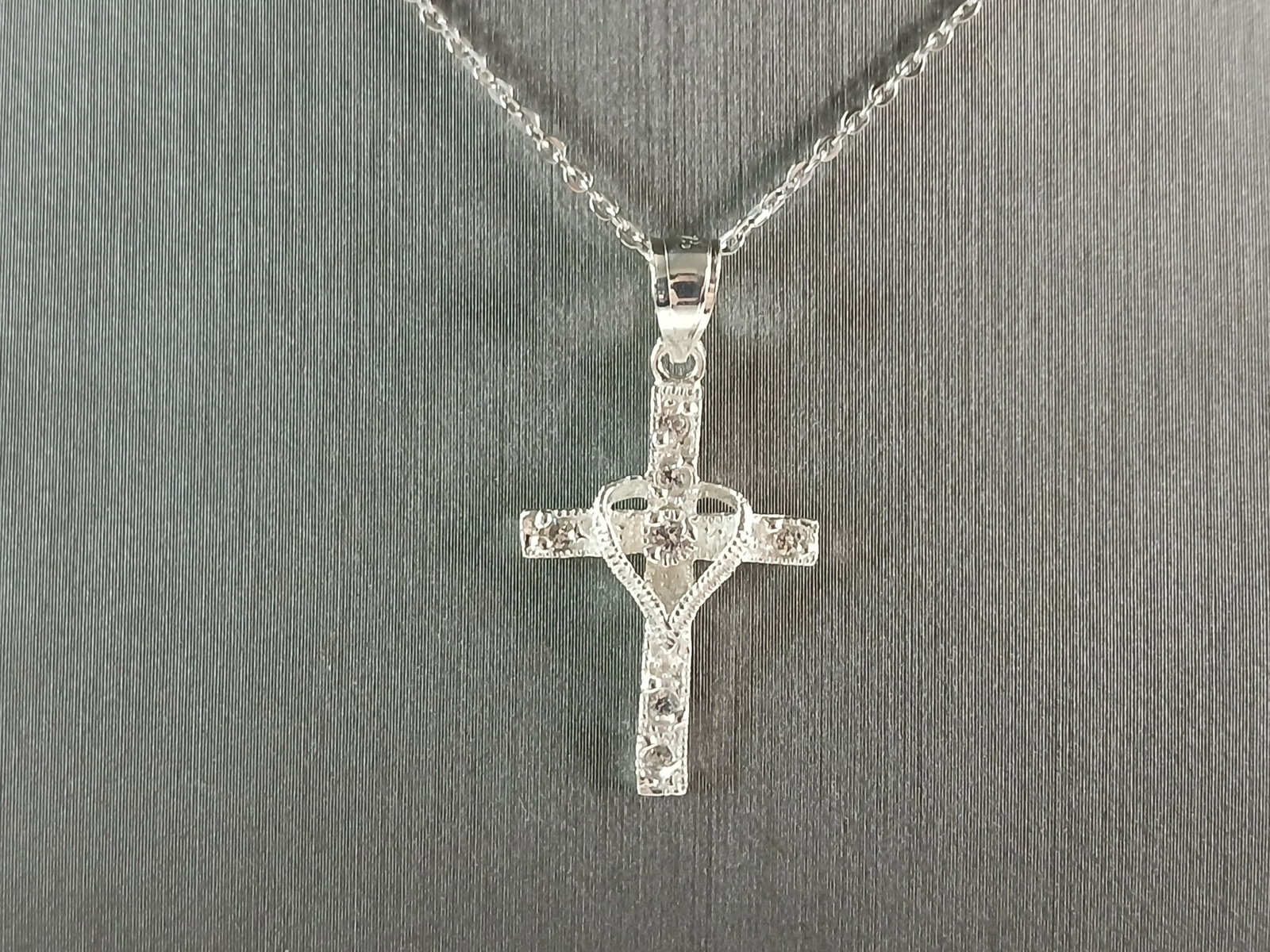 Womens Sterling Silver Religious Cross Pendant Necklace: A VERY NICE STERLING SILVER RELIGIOUS CROSS NECKLACE THAT WEIGHS 3.1g. THE PENDANT MEASURES 1 1/8" LONG BY 5/8" WIDE. THE NECKLACE MEASURES 18" LONG AND IS ADJUSTABLE TO 16" LONG. ANY QUESTIONS PLEASE
