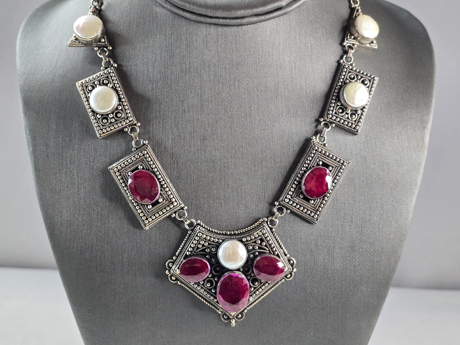 Womens Estate Sterling Silver Natural Ruby Pearl Pendant Necklace: A WOMENS VINTAGE ESTATE STERLING SILVER NATURAL RUBY & PEARL PENDANT NECKLACE. THE TOTAL WEIGHT IS 57.2g. NECKLACE IS 16 3/4" LONG. THE PENDANT PART MEASURES 2" BY 1 3/4". MAKES A GREAT GIFT FOR THAT 