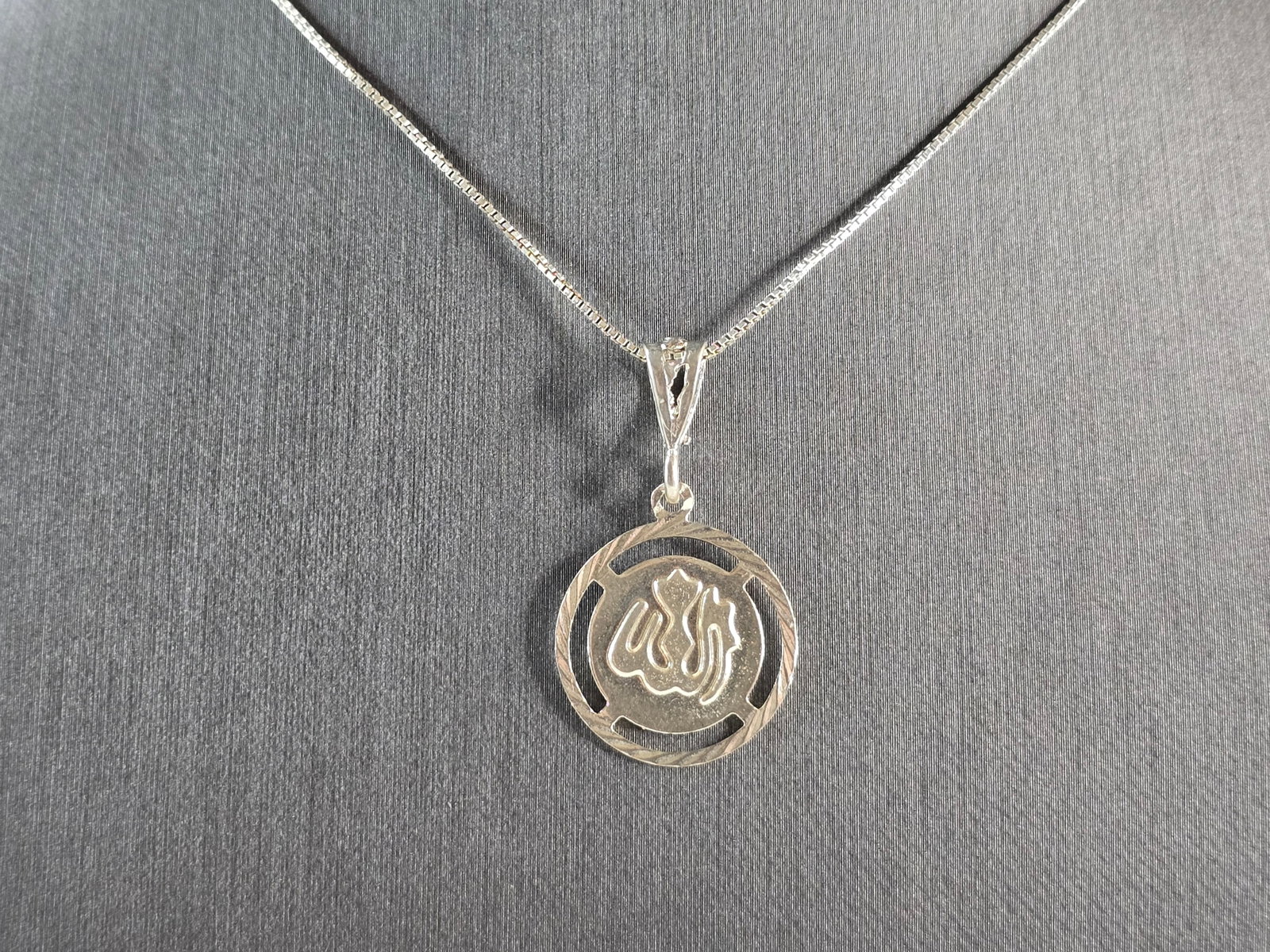 Vintage Estate Sterling Silver Islamic Muslim Allah Pendant Necklace: A VINTAGE ESTATE STERLING SILVER ISLAMIC MUSLIM ALLAH PENDANT WITH NECKLACE. THE PENDANT WITH NECKLACE WEIGHS 4.2g. THE PENDANT MEASURES 1 1/4" LONG BY 3/4" WIDE, AND THE NECKLACE MEASURES 18 1/4". MA