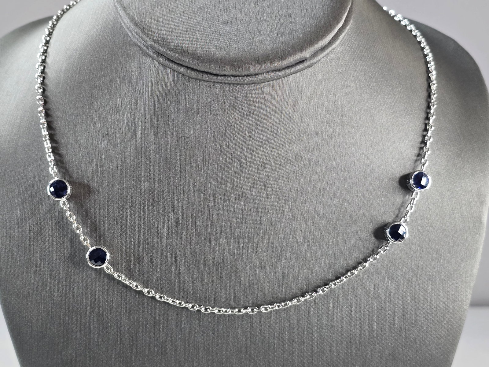 Womens Sterling Silver Sapphire Modernist Necklace: A WOMENS STERLING SILVER SAPPHIRE MODERNIST NECKLACE. NECKLACE WEIGHS 10.4g, AND MEASURES 18 3/4" LONG BY 1/4" WIDE. NOT SURE IF STONES ARE NATURAL OR MAN MADE. MAKES A GREAT GIFT FOR THAT SOMEONE SPE