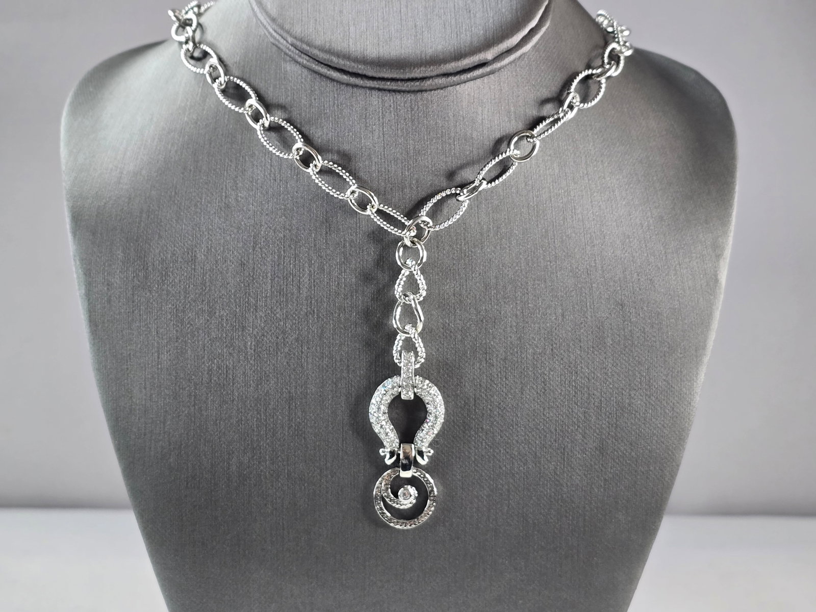 Womens Sterling Silver Modernist CZ Drop Pendant Necklace: A WOMENS STERLING SILVER MODERNIST CZ DROP PENDANT NECKLACE. NECKLACE WEIGHS 28.9g, AND MEASURES 15 5/8" LONG BY 3/4" WIDE. THE PENDANT HANGS 2 1/2". MAKES A GREAT GIFT FOR THAT SOMEONE SPECIAL. ANY Q