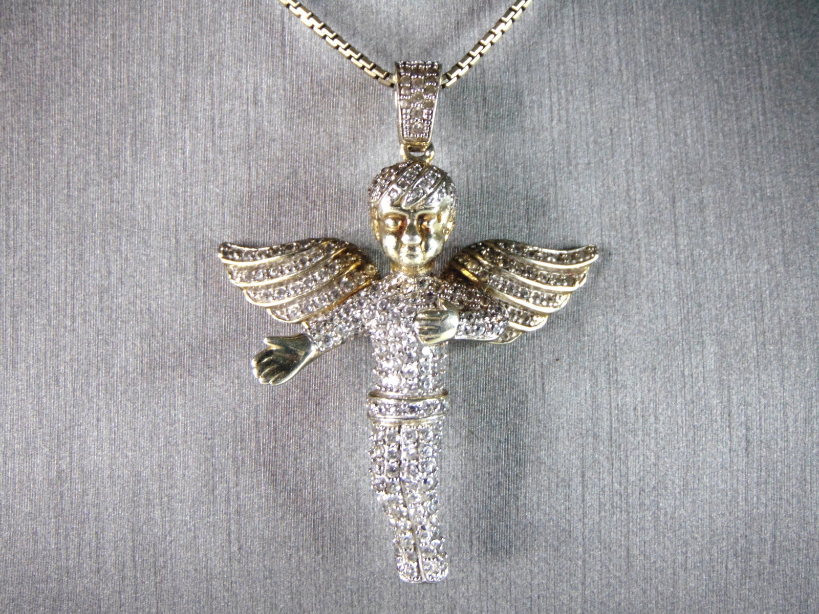Womens Vintage Estate Sterling Silver Gold Tone CZ Angel Pendant & Necklace: A VERY NICE STERLING SILVER GOLD TONE CZ ANGEL PENDANT AND NECKLACE THAT TOGETHER WEIGH 23.8g. THE PENDANT MEASURES 2 1/8" BY 1 1/2". THE NECKLACE MEASURES 28" LONG. ANY OTHER QUESTIONS PLEASE DONT HE