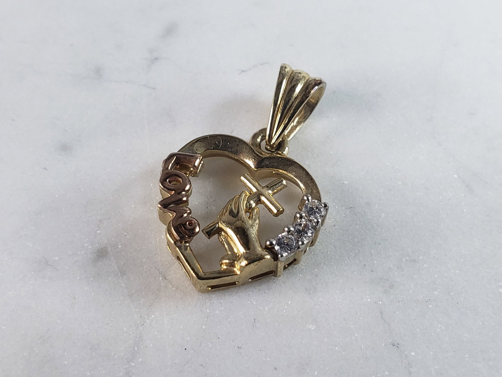 Womens Vintage Estate 10K Yellow & Rose Gold Heart Cross Pendant: FOR SALE IS THIS LOVELY VINTAGE 10K YELLOW & ROSE GOLD HEART WITH A CROSS PENDANT. THE TOTAL WEIGHT IS 3.3g. THE PENDANT MEASURES 1" LONG BY 1/2" WIDE. PENDANT IS NOT MARKED BUT IT HAS BEEN TESTED AND