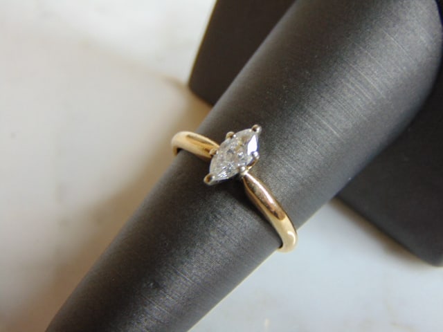 Vintage Estate Womens 14K Yellow Gold Diamond Ring: FOR SALE IS THIS VINTAGE ESTATE 14K YELLOW GOLD DIAMOND MARQUISE ENGAGEMENT RING. THE RING IS A SIZE 6.75 AND WEIGHS 2.3g. THE DIAMOND IS ABOUT .50cts. DIAMOND HAS ABEAUTIFUL SPARKLE TO IT. THE RING M