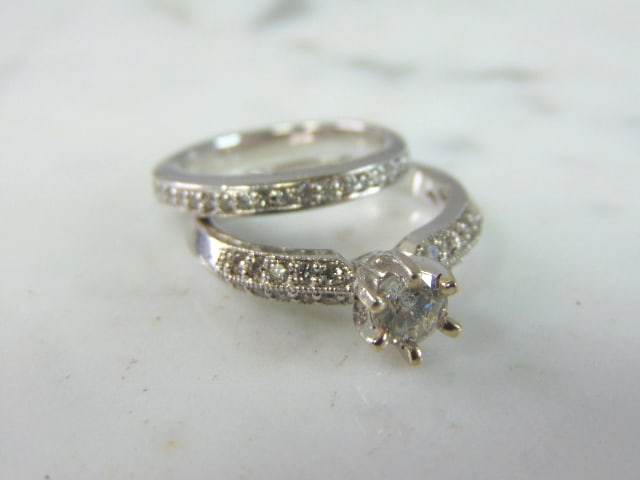 Womens Vintage Estate 14K White Gold Diamond Ring Set: FOR SALE IS THIS VINTAGE ESTATE 14K GOLD DIAMOND ANNIVERSARY RING SET. THE RINGS ARE A SIZE 6.5 AND 4.5 AND TOGETHER WEIGH 6.4g. THERE ARE ABOUT .60cts WORTH OF DIAMONDS IN THE ONE RING, AND ABOUT .20