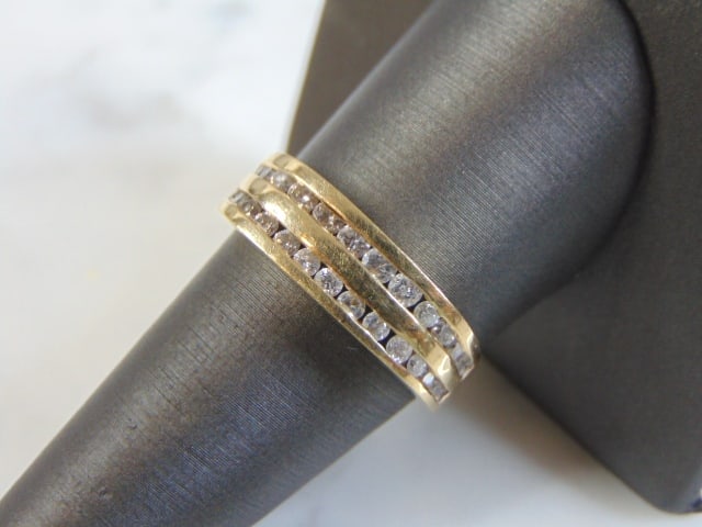 Mens Vintage Estate 14k Yellow Gold Diamond Ring: A MENS VINTAGE ESTATE 14K YELLOW GOLD DIAMOND RING WITH ABOUT 1.44cts OF DIAMONDS. THE RING IS A SIZE 9.0, AND WEIGHS 5.9g. THE FACE OF THE RING MEASURES 1/4" WIDE. RING IS ETCHED ON THE INSIDE "LOVE 