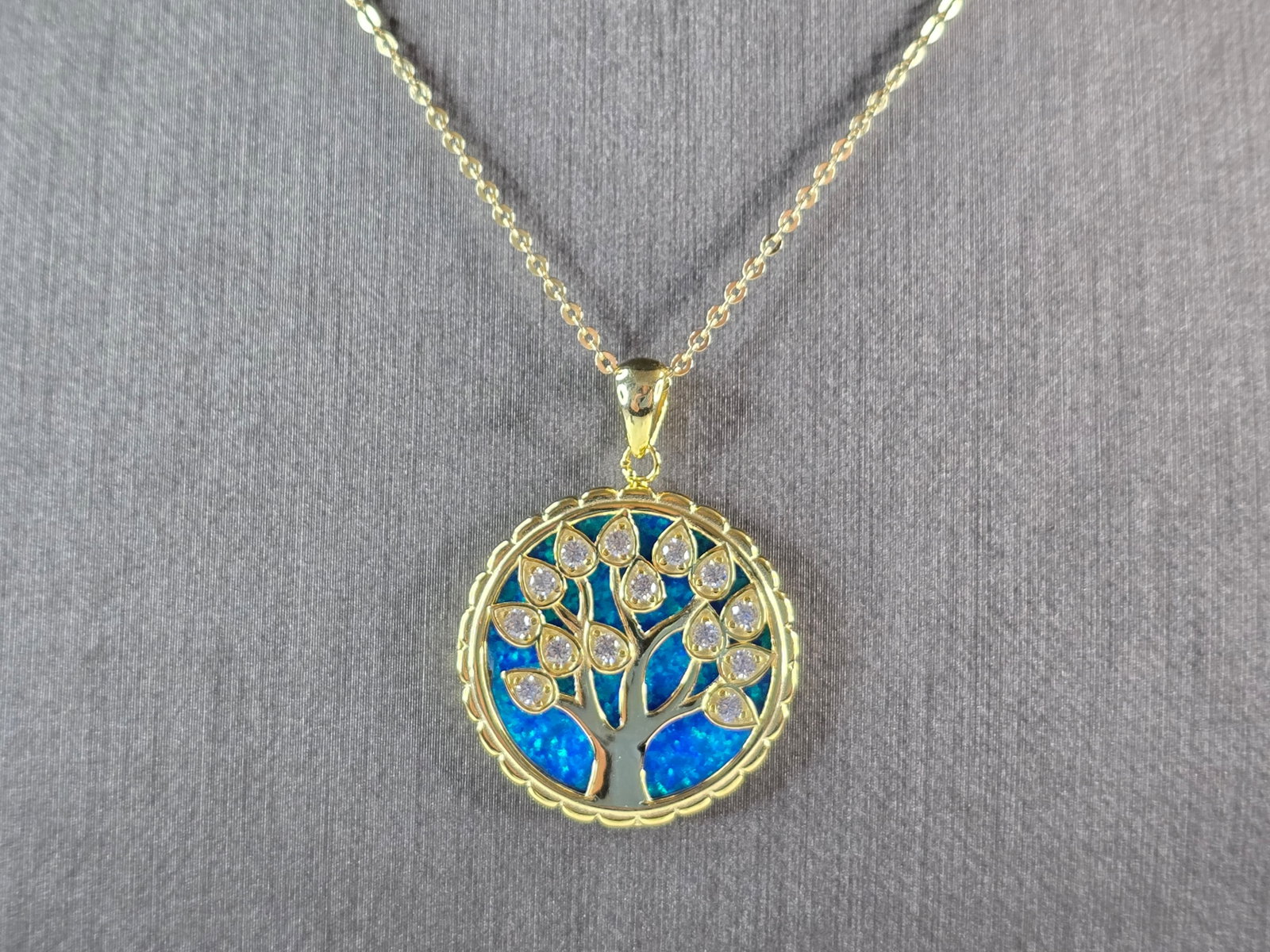 Womens Sterling Silver Gold Tone Opal Tree of Life Pendant Necklace: A WOMENS ESTATE STERLING SILVER GOLD TONE OPAL TREE OF LIFE PENDANT WITH NECKLACE. THE PENDANT WITH THE NECKLACE WEIGHS 7.4g. PENDANT MEASURES 1 1/4" LONG BY 7/8" WIDE. THE NECKLACE MEASURES 18" LONG,