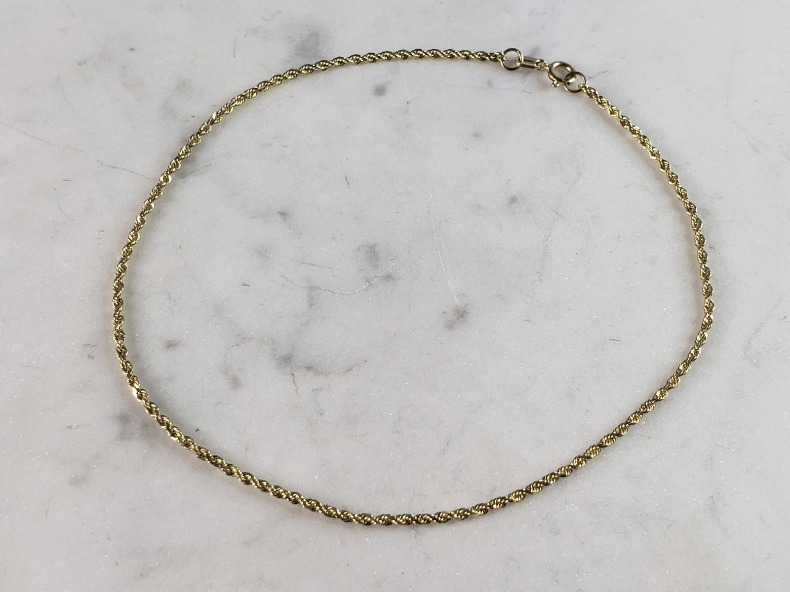 Womens Vintage Estate 14K Yellow Gold Rope Bracelet: A LOVELY VINTAGE ESTATE 14K YELLOW GOLD ROPE BRACELET. THE BRACELET IS 9 1/2" LONG FROM THE CLASP BY 1/8" WIDE, AND WEIGHS 2.0g. BRACELET IS MARKED 14K NEAR THE CLASP. THIS WOULD MAKE A LOVELY GIFT FO