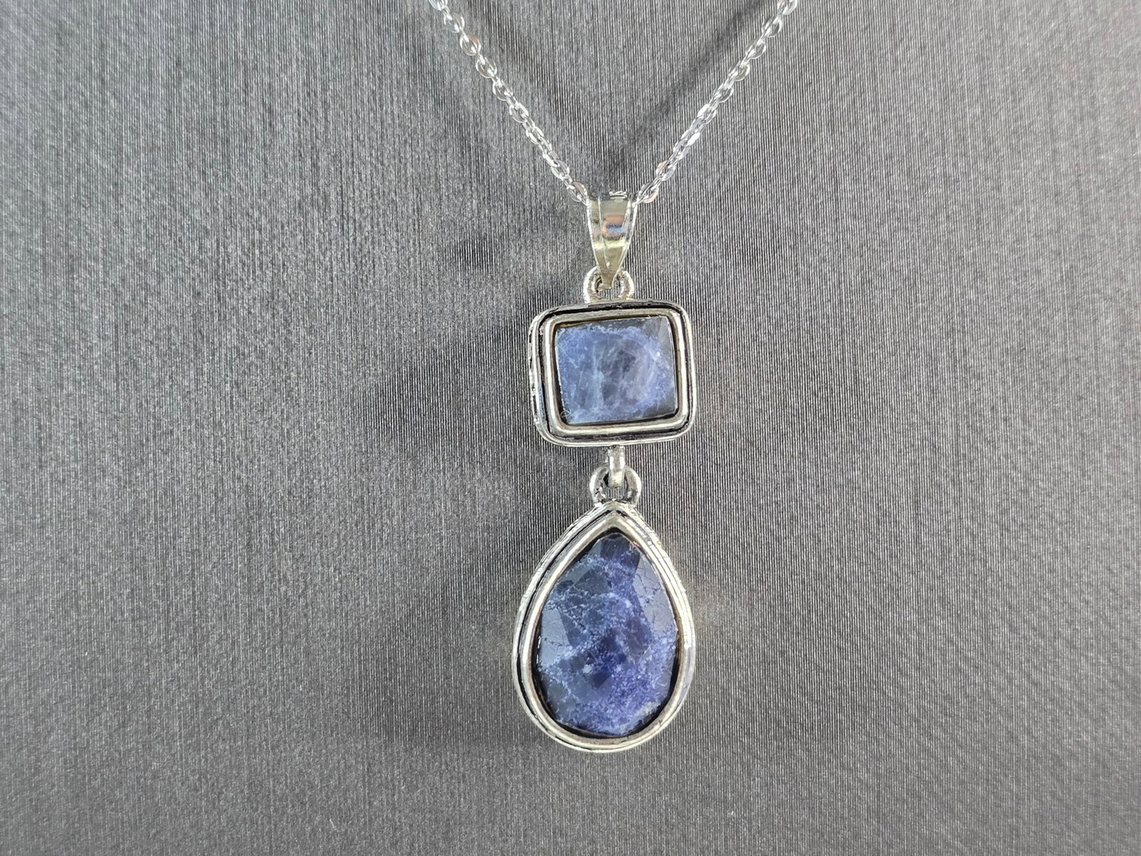 Womens Estate Sterling Silver Natural Sapphire Pendant Necklace: A WOMENS ESTATE STERLING SILVER NATURAL SAPPHIRE OR SODALITE PENDANT WITH NECKLACE. PENDANT AND NECKLACE WEIGHS 8.5g. PENDANT MEASURES 1 1/2" LONG BY 1/2" WIDE. THE NECKLACE MEASURES 18" LONG. MAKES A