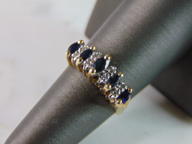 Womens Vintage Estate 14K Yellow Gold Blue Sapphire & Diamond Ring: A WOMENS 14K YELLOW GOLD RING WITH BLUE SAPPHIRE STONES, AND ABOUT .08cts OF DIAMONDS. THE RING WEIGHS 3.7g, AND IS A SIZE 6.5. RING IS MARKED ON THE INSIDE OF THE BAND. ANY QUESTIONS PLEASE DO NOT HE