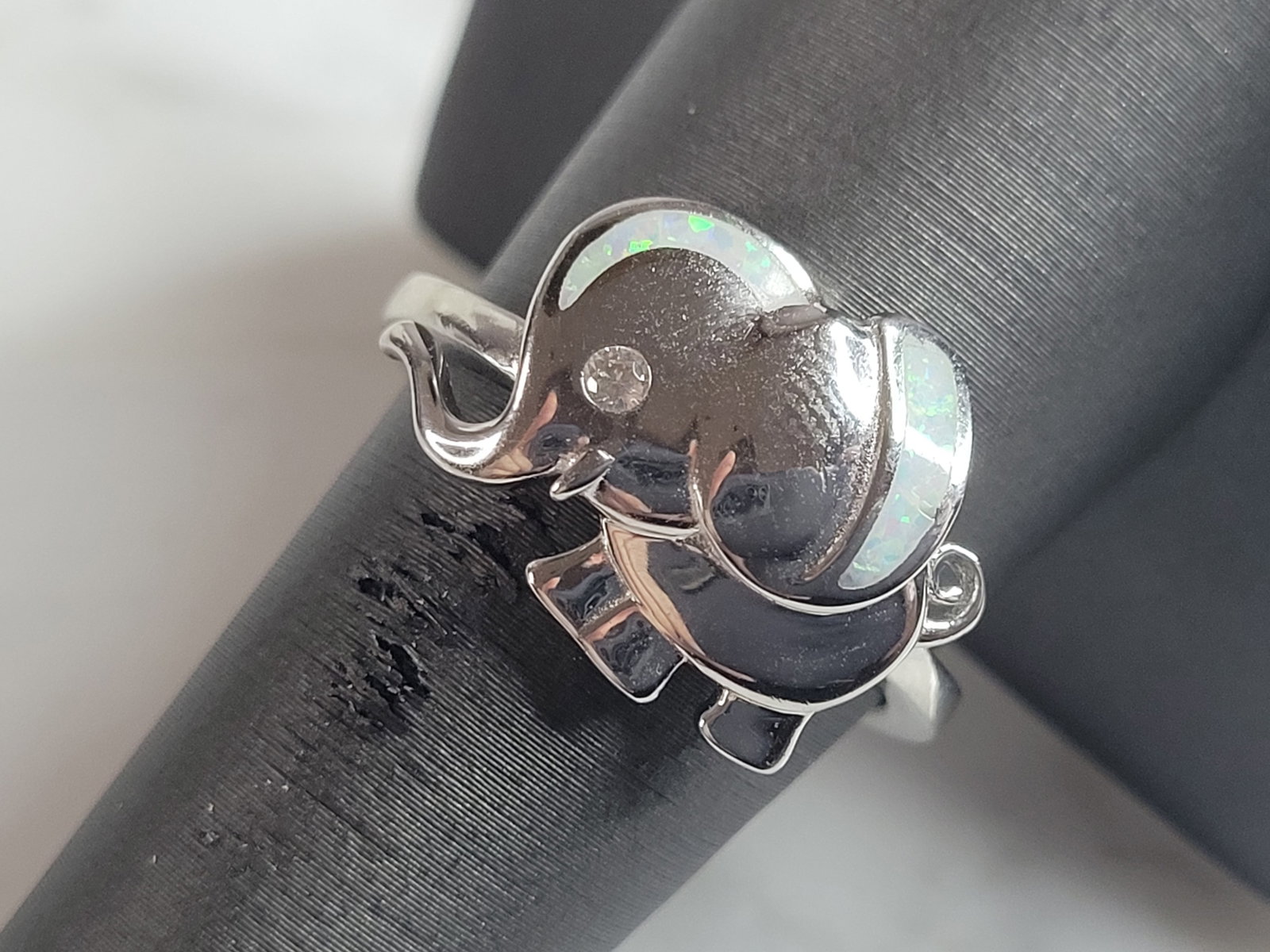 Womens Sterling Silver Modernist Opal Elephant Ring: A WOMENS STERLING SILVER MODERNIST OPAL ELEPHANT RING. THE RING IS A SIZE 8.25 AND WEIGHS 6.7g. THE WIDTH OF THE RING IS 1/2". THE RING MAKES A BEAUTIFUL GIFT FOR THAT SOMEONE SPECIAL. ANY QUESTIONS, 