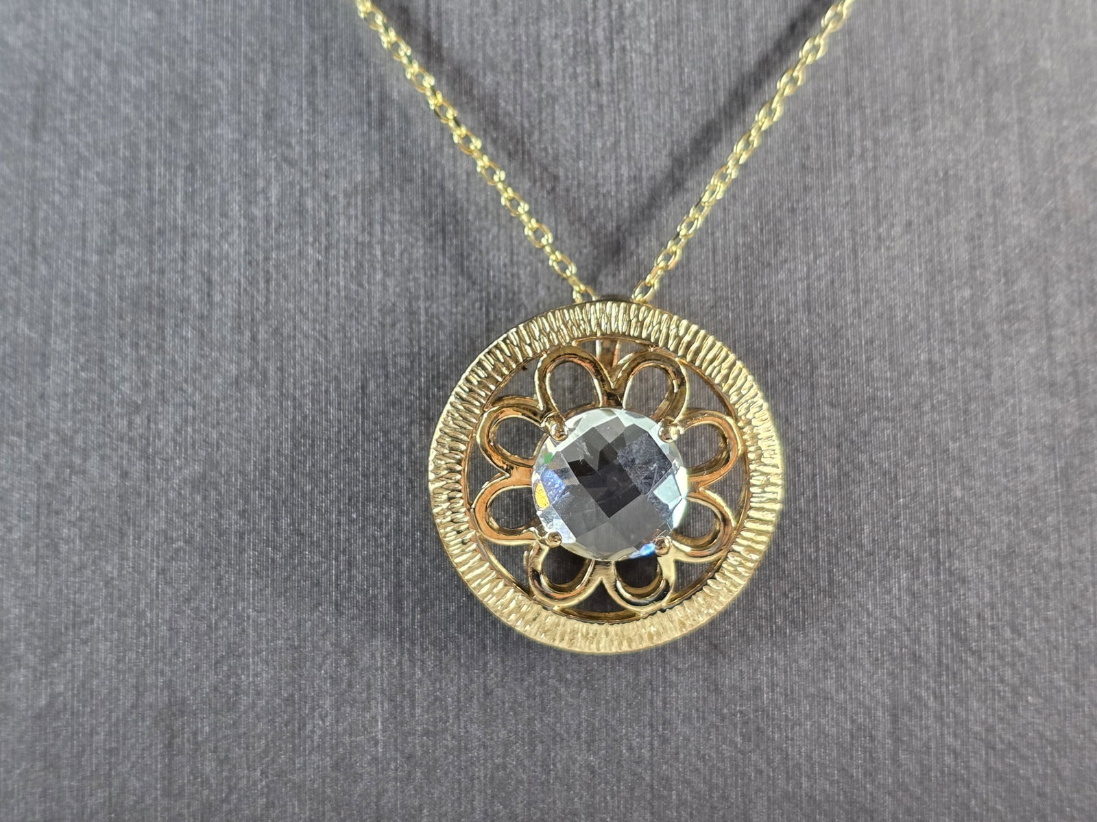 Womens Sterling Silver Gold Tone Modernist Pendant Necklace: A WOMENS GOLD TONE STERLING SILVER MODERNIST CZ PENDANT WITH NECKLACE. THE TOTAL WEIGHT IS 7.5g. PENDANT MEASURES 7/8" LONG BY 7/8" WIDE, AND NECKLACE IS 17 3/4" LONG. NOT SURE IF THE STONE IS NATURAL