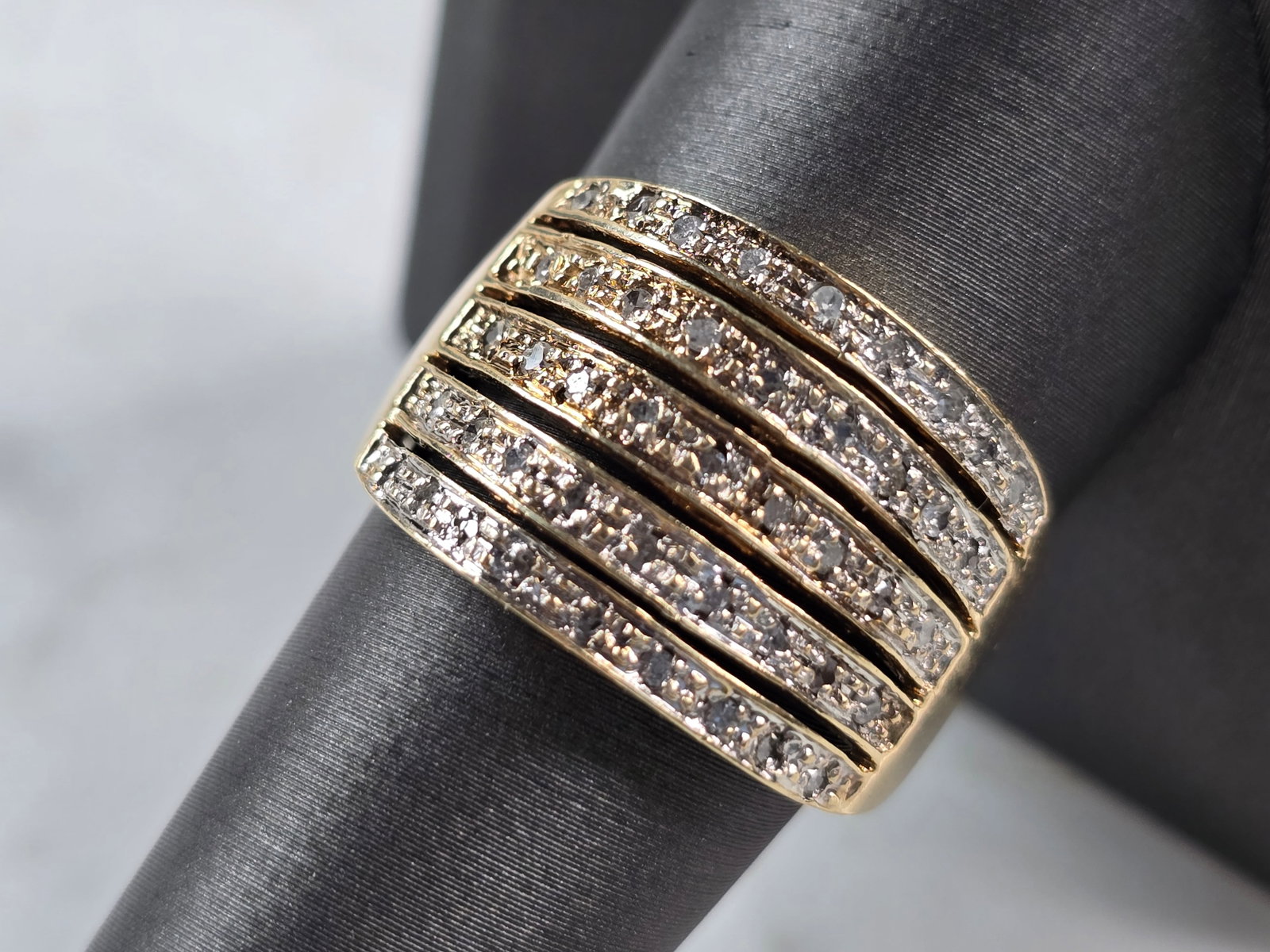 Womens Vintage Estate 10K Yellow Gold Diamond Ring: A WOMENS VINTAGE ESTATE 10K YELLOW GOLD DIAMOND RING. THE TOTAL WEIGHT IS 5.8g, AND IS A SIZE 9.5. THE WIDTH OF THE RING IS 5/8". THERE ARE 35 TINY DIAMONDS IN THIS RING. ANY QUESTIONS PLEASE DONT HES