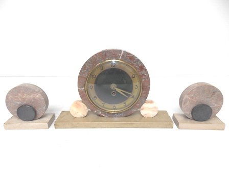 VINTAGE ANTIQUE ART DECO MARBLE CLOCK SET: VINTAGE ANTIQUE ART DECO MARBLE CLOCK SET. THE CLOCK MEASURES 8 3/4" TALL BY 13 1/2" LONG BY 2 3/4" WIDE. THE LITTLE BOOKENDS MEASURE 5" BY 5" BY 2 1/4". NOT SURE WHO THE MAKER IS. DOES HAVE FLAWS AND