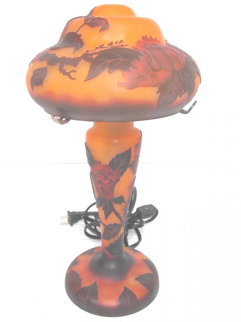 GALLE CAMEO GLASS LAMP WITH RED ROSE: A SIGNED GALLE CAMEO GLASS LAMP WITH RED ROSE MOTIF. MEASURES 14 INCHES TALL. THE SHADE MEASURES 7 1/2 INCHES IN DIAMETER. THE LAMP USES A BULB UNDER THE SHADE AND IN THE BODY OF THE LAMP. THE LAMP TU