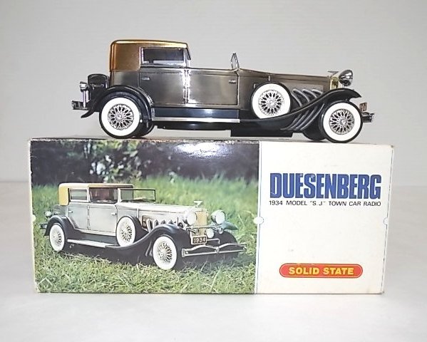 COLLECTIBLE 1934 DUESENBERG TOWN CAR TRANSISTOR RADIO: A SUPER COLLECTIBLE 1934 DUESENBERG MODEL THAT IS ALSO A SOLID STATE RADIO. THE MODEL MEASURES 10" LONG BY 3 1/2" TALL. COMES WITH ITS ORIGINAL BOX AND LOOKS AS THOUGH IT WAS NEVER USED. SHIPPING IS $