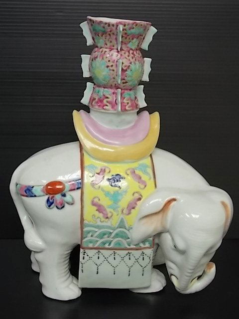 DECORATIVE HAND PAINTED PORCELAIN ELEPHANT VASE: FOR SALE IS THIS DECORATIVE HAND PAINTED PORCELAIN ELEPHANT VASE THAT MEASURES 14 1/4" TALL BY 12" LONG BY ABOUT 6 1/2" WIDE. NOT SURE WHO THE MAKER IS BUT IT IS STAMPED. MAKES A NICE LITTLE DECORATOR