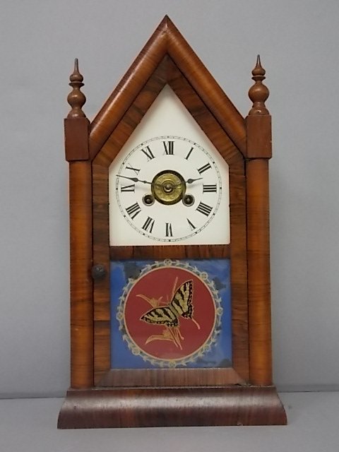 ANTIQUE OGEE CATHEDRAL MANTLE CLOCK JEROME & CO.: FOR SALE IS THIS OLD ANTIQUE OGEE CATHEDRAL MANTLE CLOCK THAT WAS MADE BY JEROME & CO . CLOCK HAS WHAT LOOKS LIKE A BEAUTIFUL MAHOGANY OR WALNUT CASE. CLOCK MEASURES 15 1/4" TALL BY 8 1/4" LONG BY 3 3