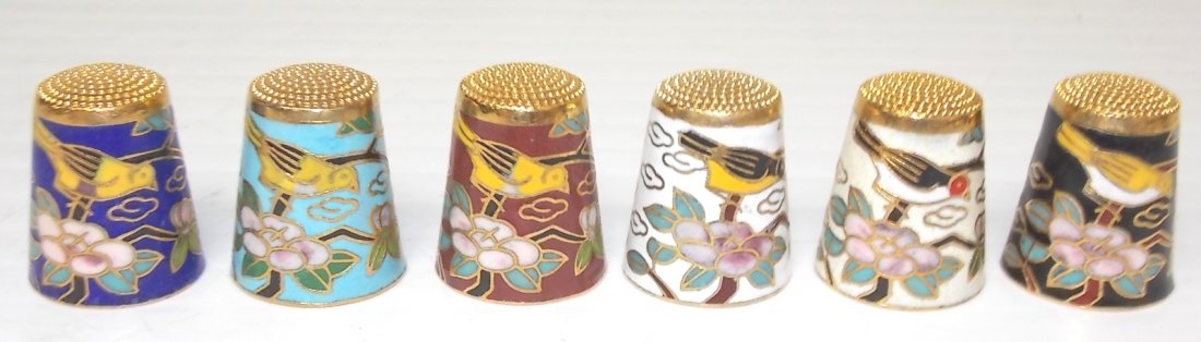 SET OF 6 CHINESE CLOISONNÉ THIMBLES: SET OF 6 CHINESE CLOISONNÉ THIMBLES WITH BIRD AND TREE BRANCH MOTIF EACH STAND 1” TALL AND MEASURES 3/4” IN DIAMETER. Note: This item tested positive for traces of gold by U. S. Customs agents. T