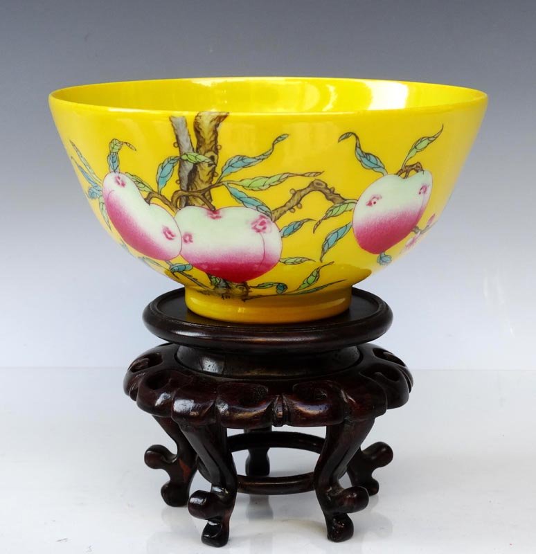 A Fine Chinese Qing Famille Rose Porcelain Bowl: A Fine Chinese Qing Dynasty Yellow Ground Famille Rose Porcelain Bowl with a Yongzheng Mark, Decorated with a Painting of Peaches and Bats, Size: H*D 7*14.5cm