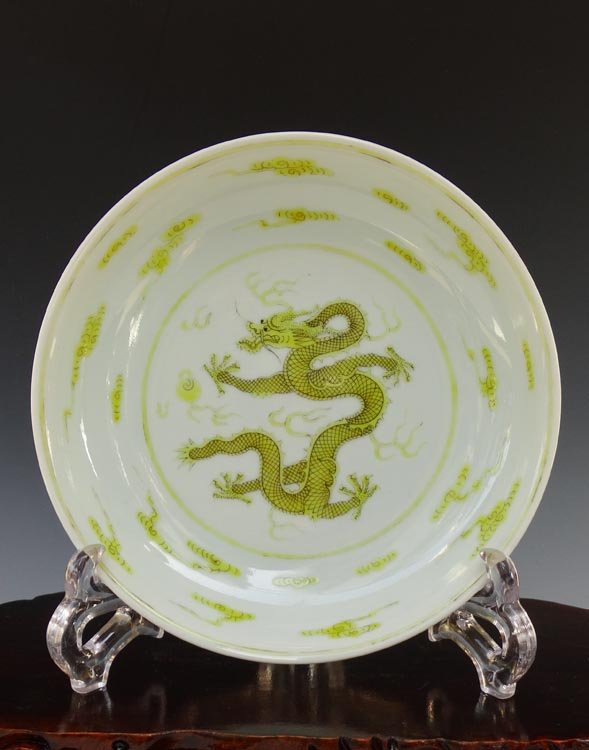 A Chinese Qing Yellow Dragons Porcelain Plate: A Chinese Qing Yellow Dragons Porcelain Plate with Qianlong Mark, Size: H*D 3.7*17cm, Highly Important Item, Auction Classification and Museum Quality Guarantee.