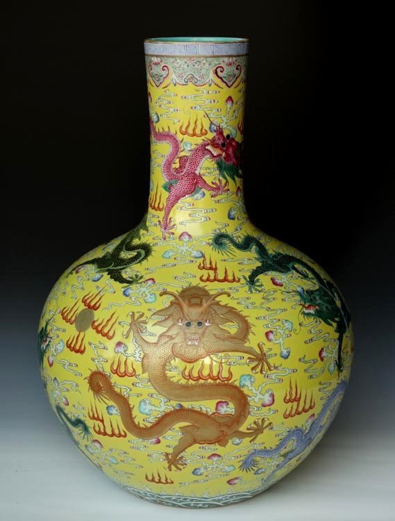 Antique Huge Chinese Qing Famille Rose Porcelain Vase: An Antique Huge Yellow Ground Chinese Qing Famille Rose Nine Dragons Painting Porcelain Vase with a Qianlong Mark, Size: H*D 62*46cm..