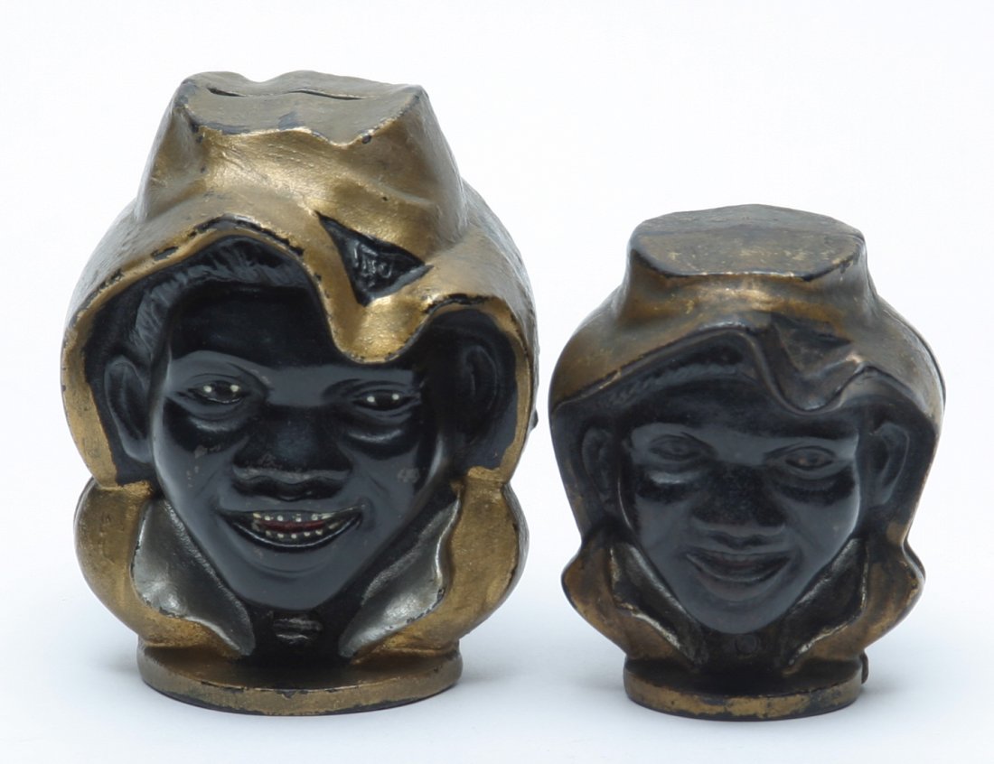 Black Americana Two-Faced Boy Penny Banks.: Lot of Two. Large & small examples. Small with original paint, large repainted.
