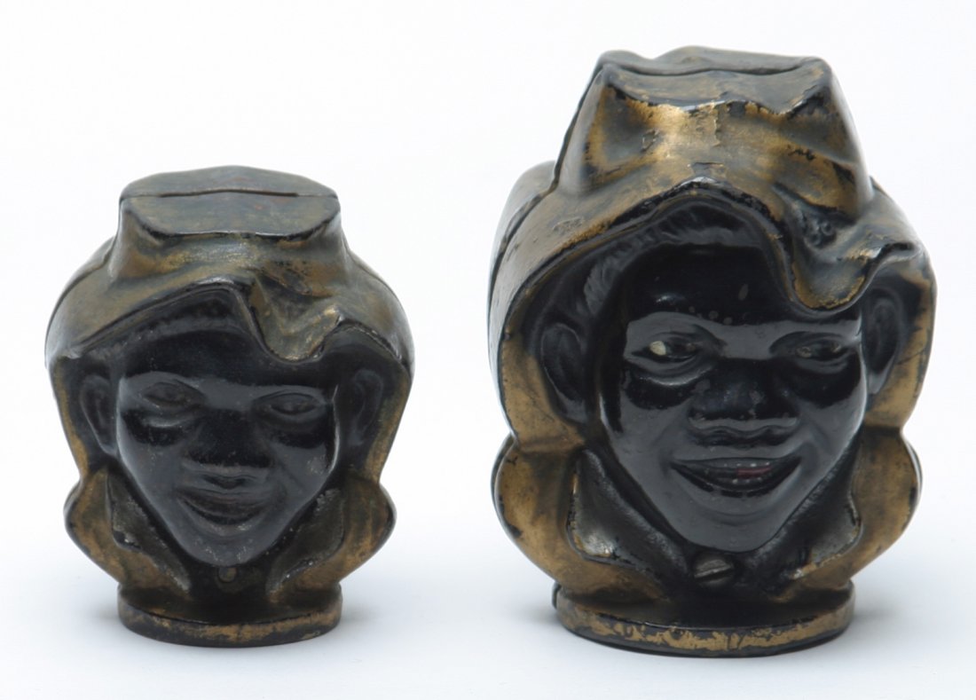 Black Americana Two-Faced Boy Penny Banks.: Lot of Two. Large & small examples. Both appear to have original paint. Wear to paint.