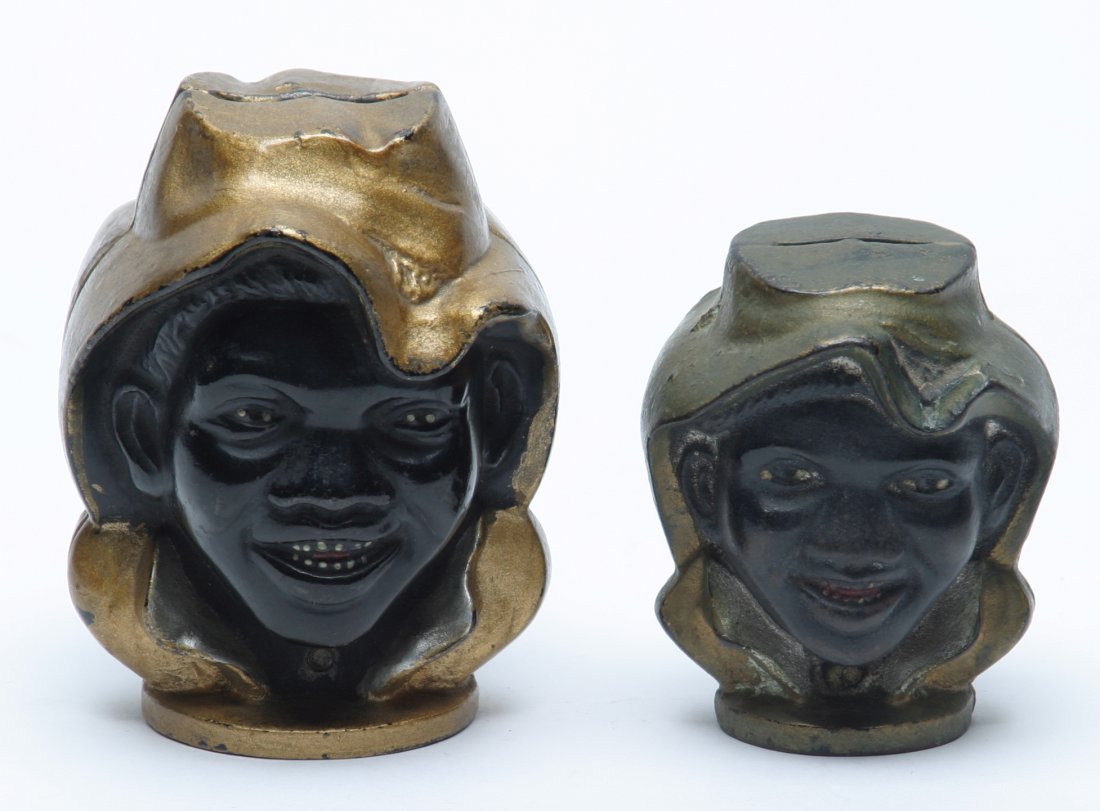 Black Americana Two-Faced Boy Penny Banks.: Lot of Two. Large & small examples. Small bank with original paint. Large bank repainted.