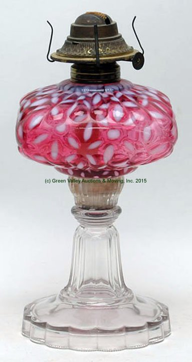 Hobbs Snowflake Cranberry Opalescent Oil Lamp: Hobbs Snowflake Cranberry Opalescent Oil Lamp. Metal connector cemented to glass sleeve. 9 3/4" H to top of collar. Lee Roy Weaver Estate, Stanley, Virgina.